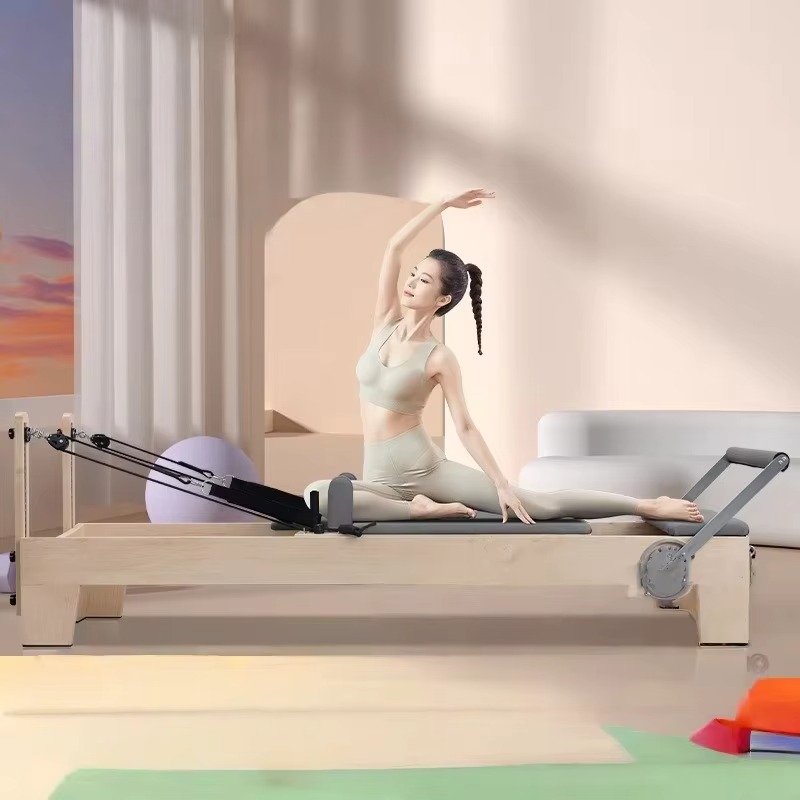 سرير بيلاتس عالي الجودة من خشب - مراجعة Pilates Reformer Spring وسعره